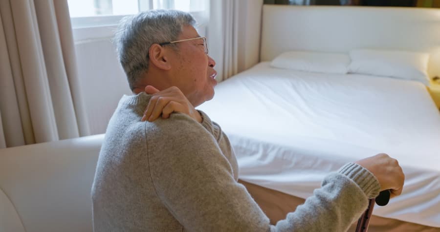 Elderly individual with neck pain