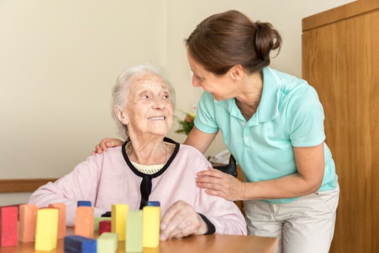 Home caregiver and senior adult resident