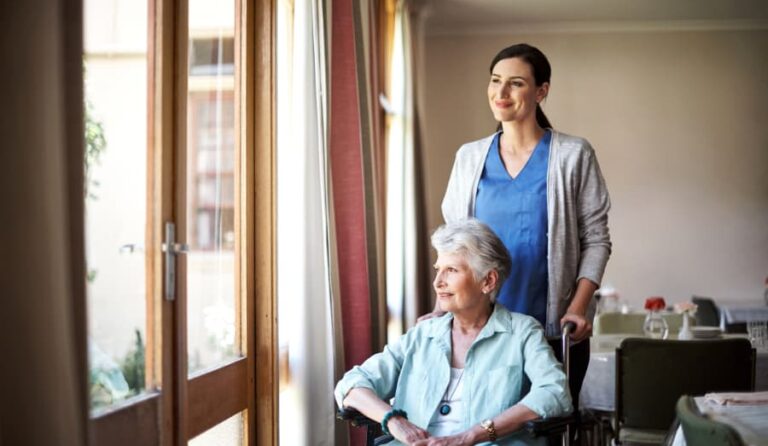 Shot of nurse caring for resident in wheelchair