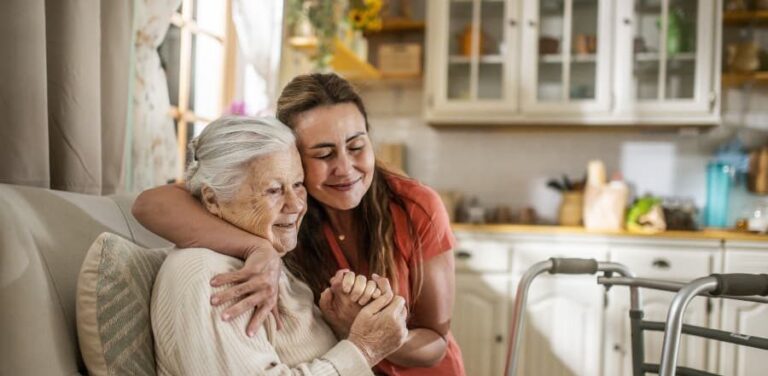 Daughter assisting family member with walker at home