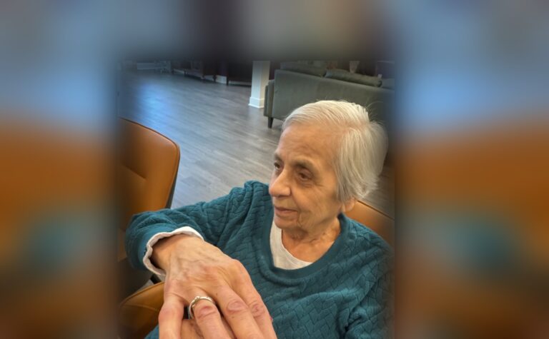 A Fox Trail memory care resident sitting in a lounge chair in one of our New Jersey communities